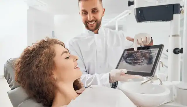 modern dental clinic with dentist treating a smiling patient