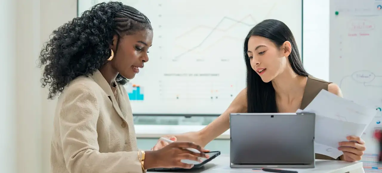 professional accountant reviewing small business finances at a modern office desk