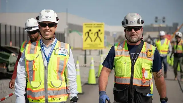 skilled tradesperson with tools working on a professional construction site