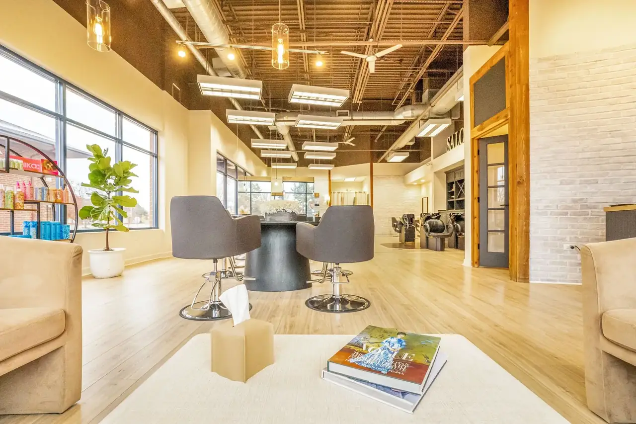 modern hair salon interior with stylist attending a client