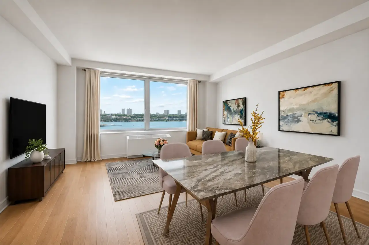 real estate agent showing a bright modern apartment to clients