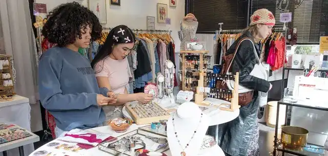 fashion ecommerce entrepreneur photographing clothing for an online store