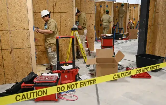 skilled tradesperson with tools working on a professional construction site