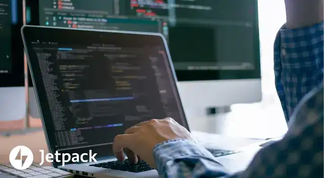 developer configuring a WordPress website on a modern laptop