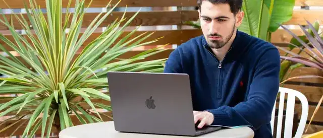 web design agency office with laptop showing a website for businesses in Madrid Spain