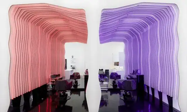 modern hair salon interior with stylist attending a client