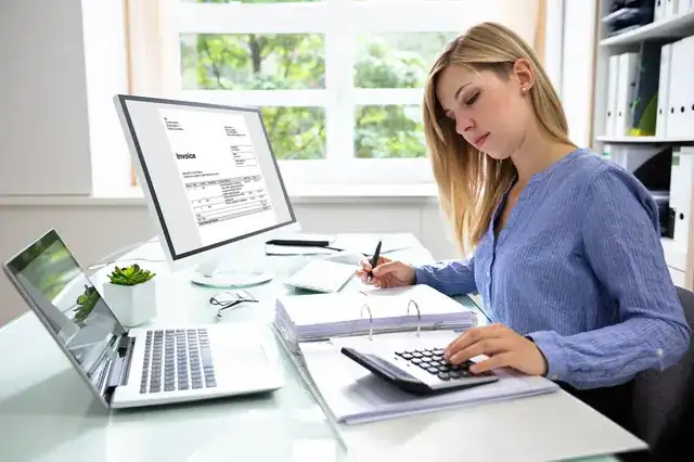 professional accountant reviewing small business finances at a modern office desk