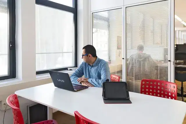 web design agency office with laptop showing a website for businesses in Barcelona Spain