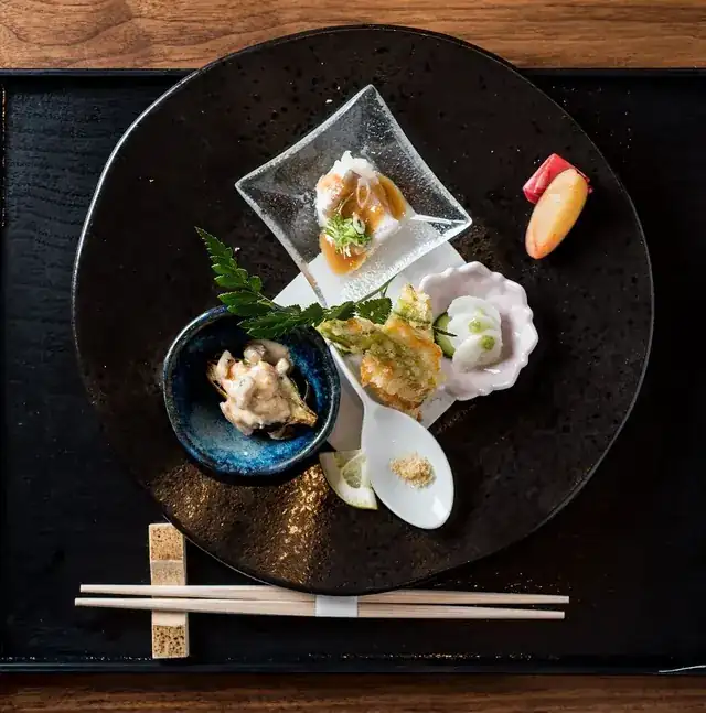 busy modern restaurant interior with chef plating gourmet dishes