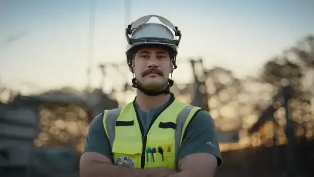 skilled tradesperson with tools working on a professional construction site