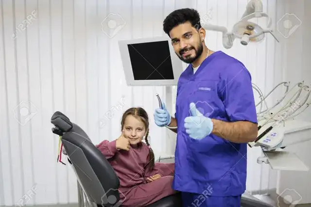 modern dental clinic with dentist treating a smiling patient