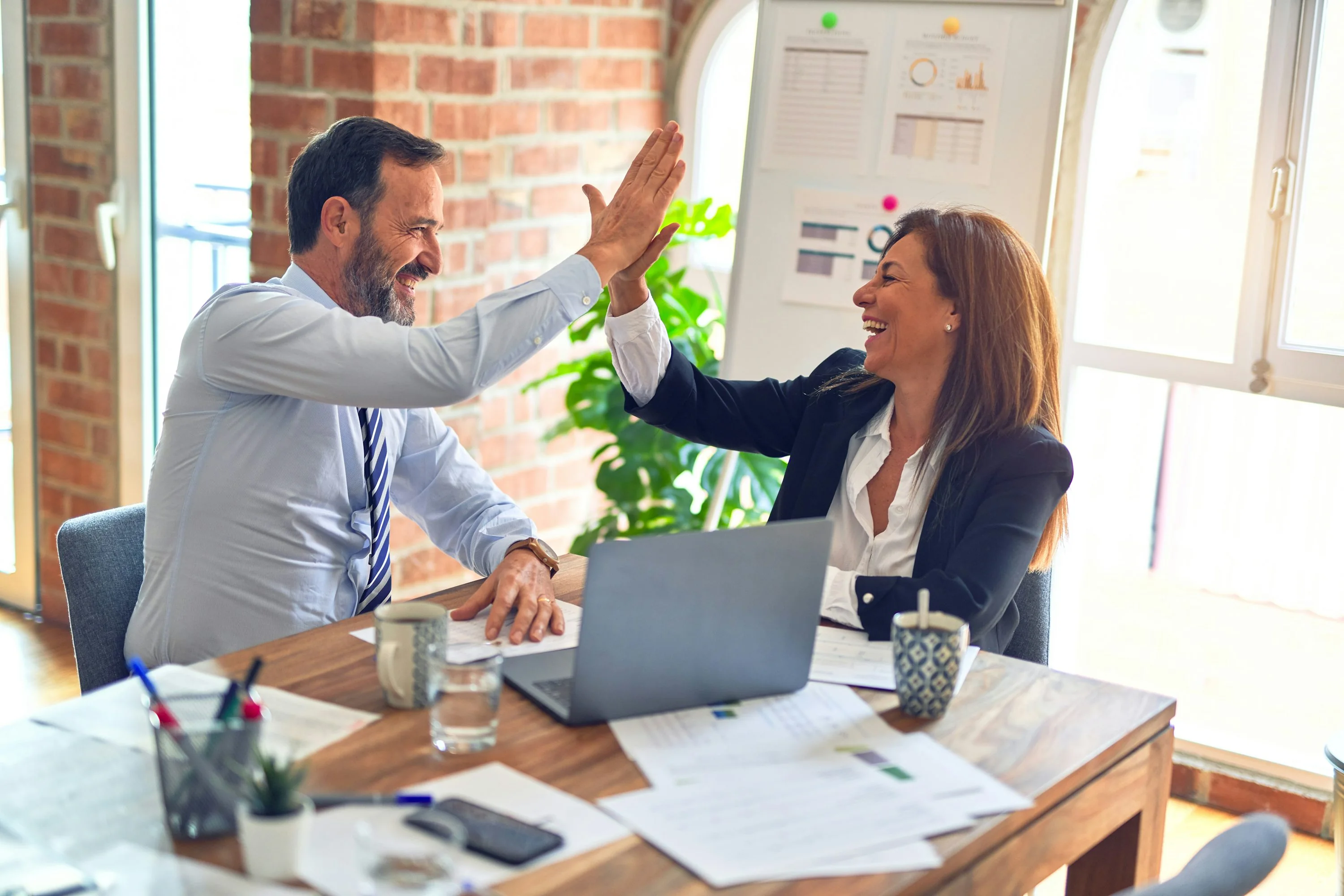 Client consultation between a business team and a creative partner