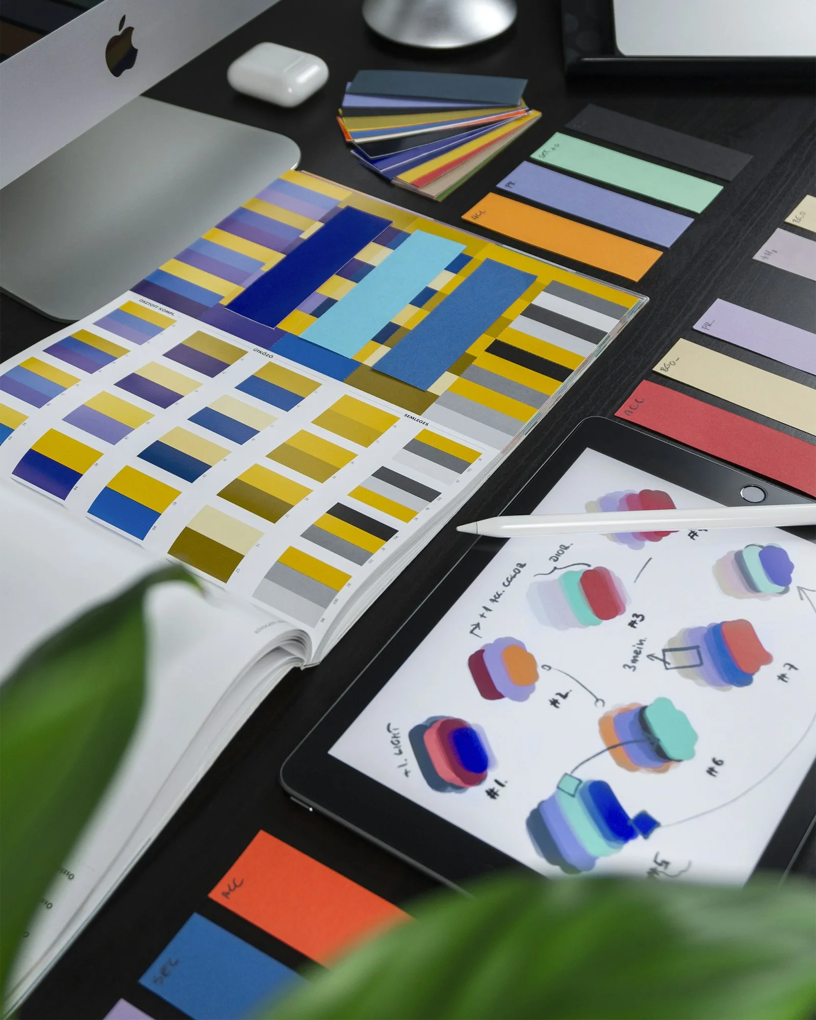 Brand identity design materials arranged on a creative studio desk